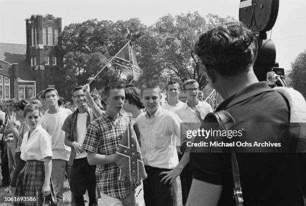 Crowd of students at Woodlawn High School in Birmingham, Alabama, flying the Confederate flag in opposition to the start of the Birmingham Campaign,...