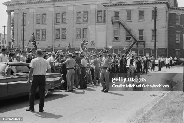 Crowd of students in Birmingham, Alabama, flying the Confederate flag in opposition to the start of the Birmingham Campaign, May 1963. The movement,...
