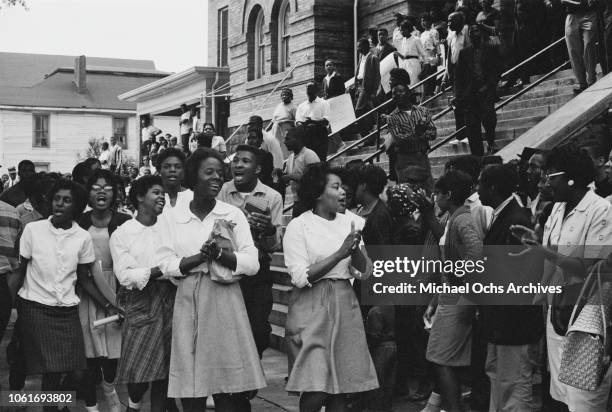 People on the steps of the 16th Street Baptist Church, headquarters of the Birmingham Campaign in Birmingham, Alabama, May 1963. The movement, which...