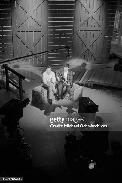 American country music singer and television host Jimmy Dean with guest musician Roy Clark on the set of 'The Jimmy Dean Show', USA, 13th November...