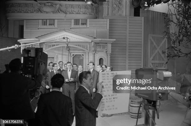 American country music singer and television host Jimmy Dean rehearses with the Chuck Cassey singers on the set of 'The Jimmy Dean Show', USA, 13th...