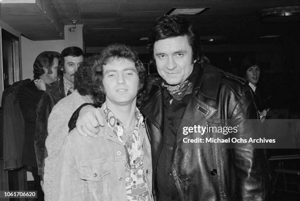 American country singer Larry Gatlin with singer Johnny Cash during an appearance on Cash's television show at the NBC studios, USA, 11th December...