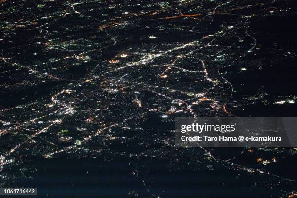 okazaki city in aichi prefecture in japan night time aerial view from airplane - okazaki stock pictures, royalty-free photos & images