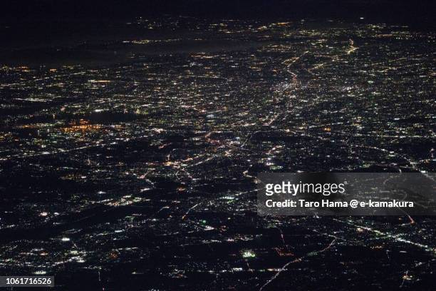 nagoya city in aichi prefecture in japan night time aerial view from airplane - nagoya stock photos et images de collection