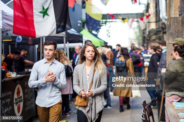 tourists and customers exploring maltby street market, london, uk - bermondsey stock pictures, royalty-free photos & images