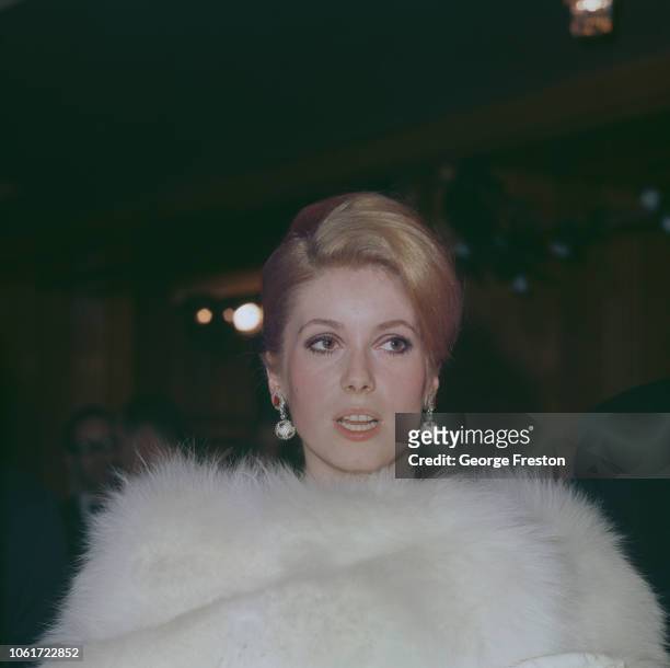 French actress Catherine Deneuve attends the Royal Film Performance of 'Born Free' at the Odeon Leicester Square in London, 14th March 1966.