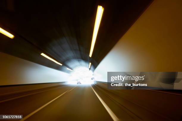 driving through a tunnel, light at the end of tunnel - car finish line stock pictures, royalty-free photos & images