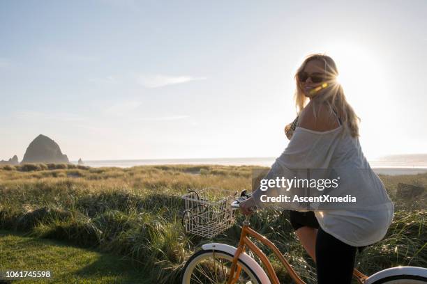 woman  beach - cannon beach imagens e fotografias de stock