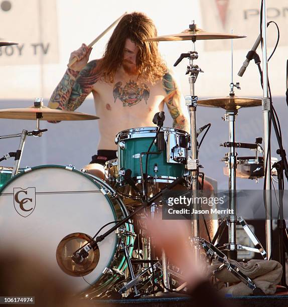 Drummer Andy Hurley of the band Fall Out Boy plays during the Direct T.V. Celebrity Beach Bowl hosted by Matt Leinart at the Scottsdale Waterfront at...