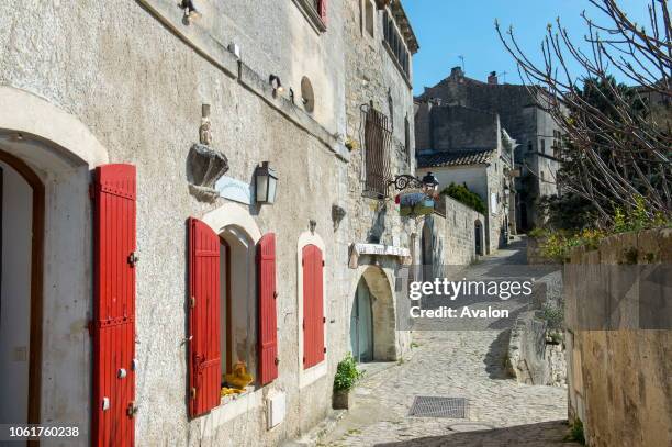 Street scene in Les Baux-de-Provence, a village in the Alpilles Mountains in the Provence-Alpes-Cote d'Azur region in southeastern France.