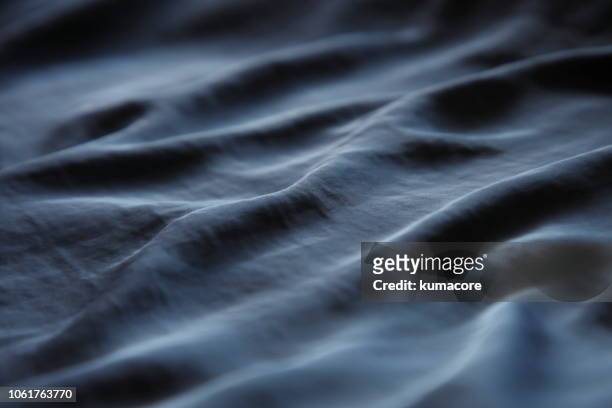 suface of indigo color cloth - fabric wave stock pictures, royalty-free photos & images