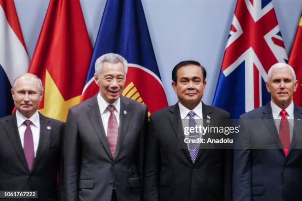 Russian President Vladimir Putin, PM Republic of Singapore Lee Hsien Loong, PM of Thailand Prayut Chan-o-cha, and U.S. Vice President Mike Pence pose...