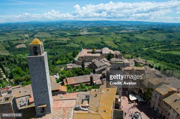View from a tower of the medieval walled hill town of San Gimignano in Tuscany, Italy and the surrounding landscape.