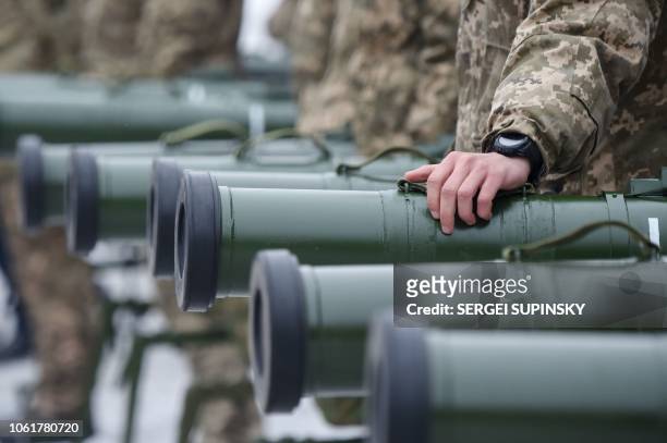Ukrainian servicemen taking part in the armed conflict with Russia-backed separatists in Donetsk region of the country attend the handover ceremony...