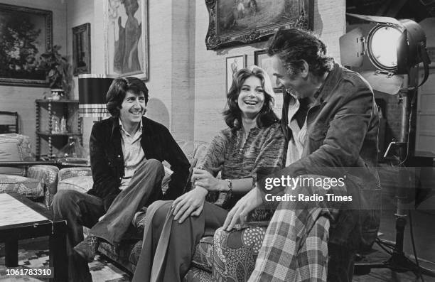 Writer Frederic Raphael talking to actors Tom Conti and Barbara Kellerman on the set of the television drama 'The Glittering Prizes', January 21st...