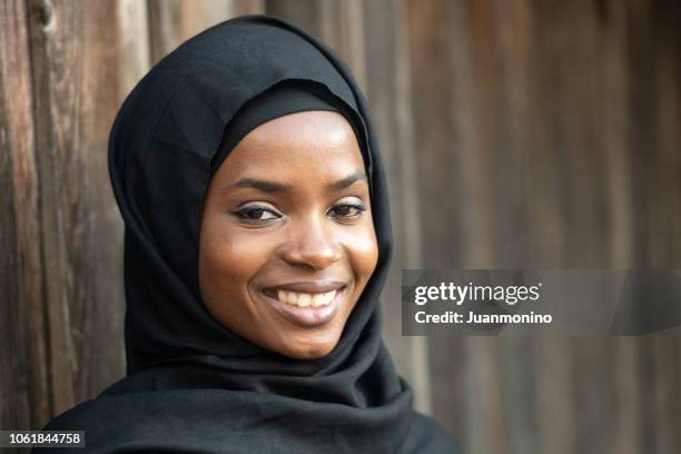 smiling muslim black young woman - sunni islam stock pictures, royalty-free photos & images
