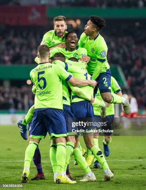 Players of Schalke 04 celebrate their win after the penalty shoot out the DFB Cup match between 1. FC Koeln and FC Schalke 04 at RheinEnergieStadion...