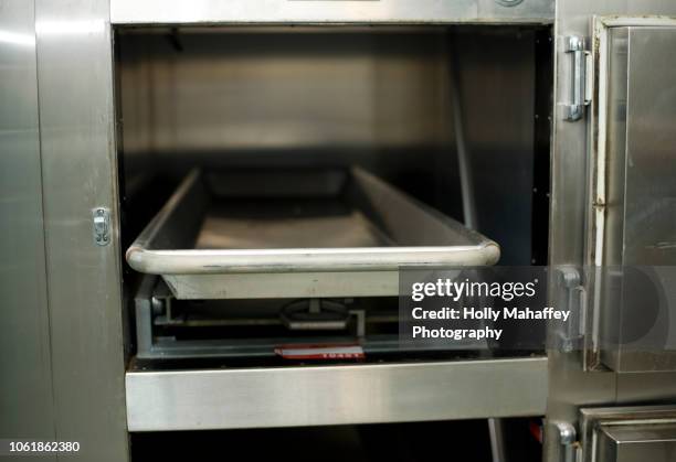 hospital morgue drawers - leichenbestatter stock-fotos und bilder