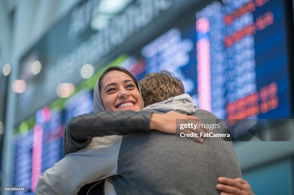 A warm embrace at the airport