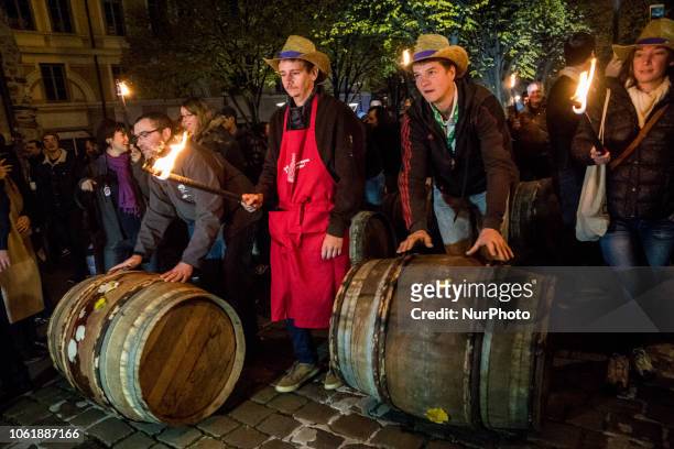 People celebrate the traditional event that starts the &quot;Beaujolais Nouveau&quot; edition in the streets of Lyon, central-eastern France, on...