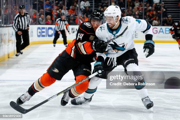 Kiefer Sherwood of the Anaheim Ducks battles for position against Brenden Dillon of the San Jose Sharks during the game on October 28, 2018 at Honda...