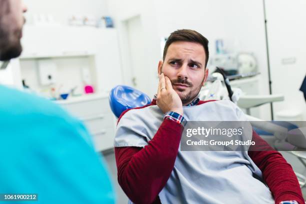 dental treatment - pain stock pictures, royalty-free photos & images