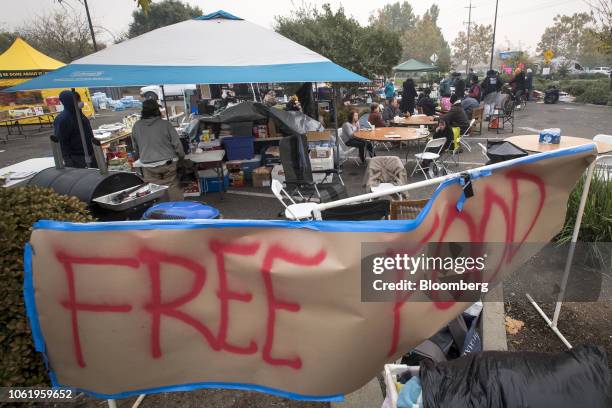 Free Food" sign is displayed for Camp Fire evacuees in Chico, California, U.S., on Thursday, Nov. 15, 2018. The number of acres burned in the blazes...