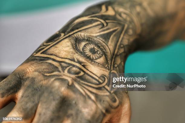 Indian Man Showing Illuminati Tattoo On His Arm In New Delhi, India, on 15 November 2018