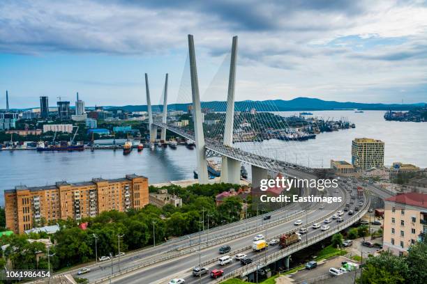 overlook over vladivostok and the new zolotoy bridge from eagle's nest mount, vladivostok, russia - vladivostok stock-fotos und bilder