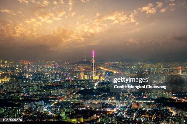 sunset scene over seoul city view from namhansanseong fortress. the best view of skyscrapers lit up with the han river in the background at seoul city, south korea - korea map stock pictures, royalty-free photos & images