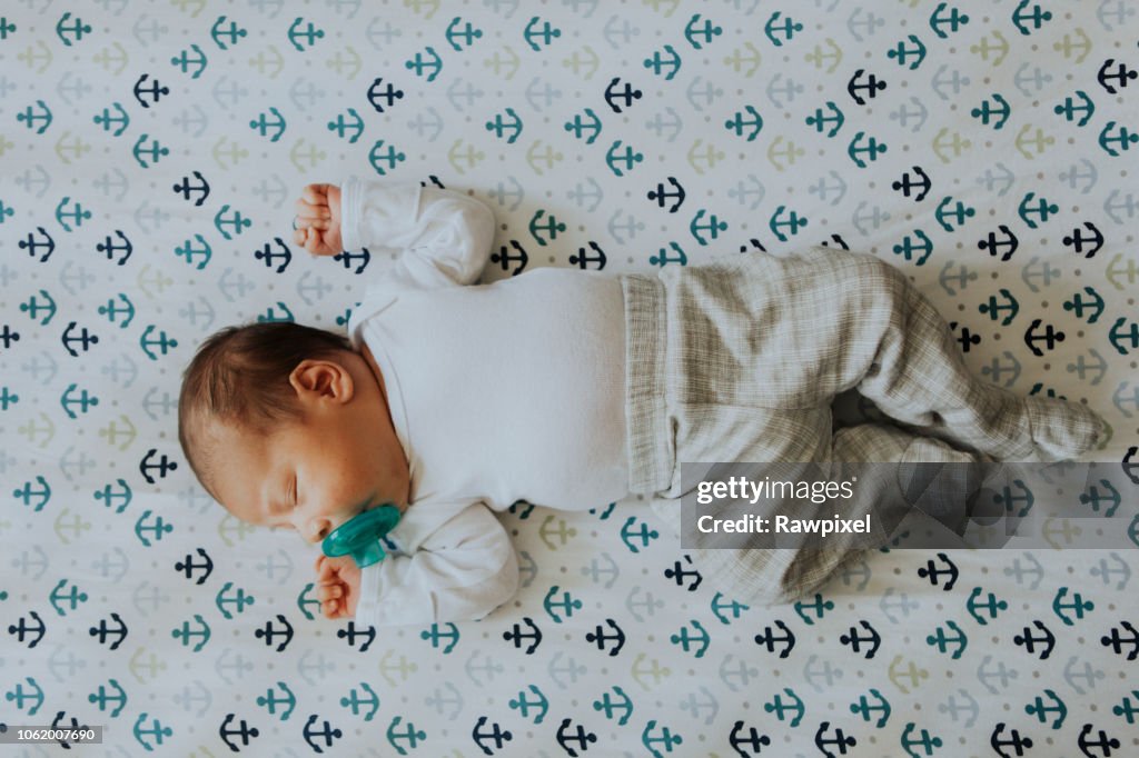 Peaceful baby sleeping in a crib