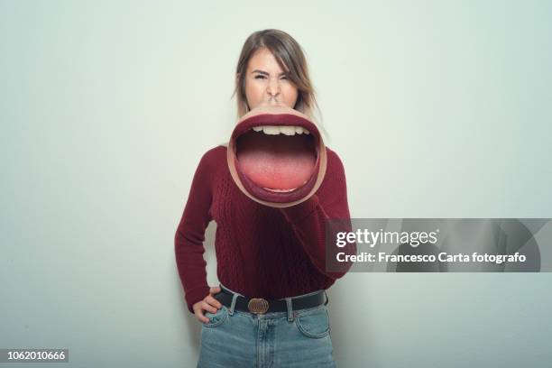 woman using a megaphone - 自信力 個照片及圖片檔