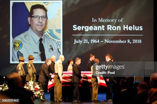 The flag-draped casket of Ventura County Sheriff Sgt. Ron Helus arrives on stage for a memorial service for Sgt. Helus at Calvary Community Church on...