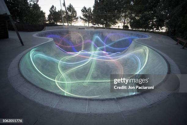 illuminated skatepark / skateboarder light painting - denver art stock pictures, royalty-free photos & images