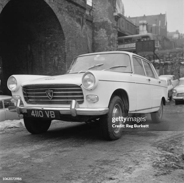 Peugeot 404, large family car produced by French automobile manufacturer Peugeot, UK, 21st January 1963.