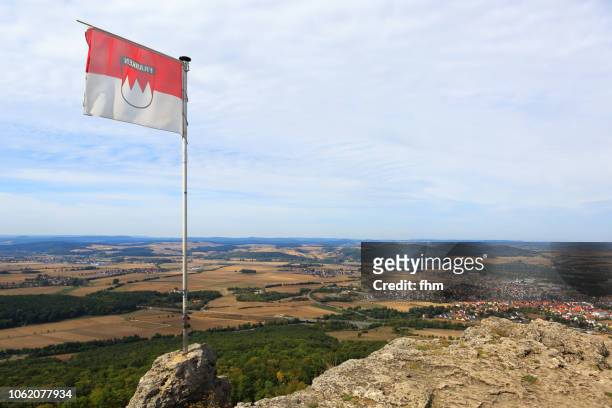 view from the staffelstein to bad staffelstein with a regional flag (upper franconia, bavaria/ germany) - upper franconia - fotografias e filmes do acervo
