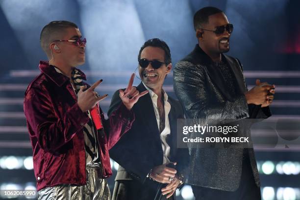 Singer Marc Anthony, US actor and rapper Will Smith and Puerto Rican singer Bad Bunny perform during the 19th Annual Latin Grammy Awards in Las...