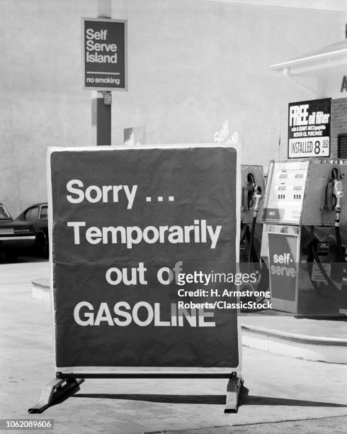 Sign at a US gas station during the oil crisis of 1973-74, reading: 'Sorry...Temporarily out of GASOLINE'.
