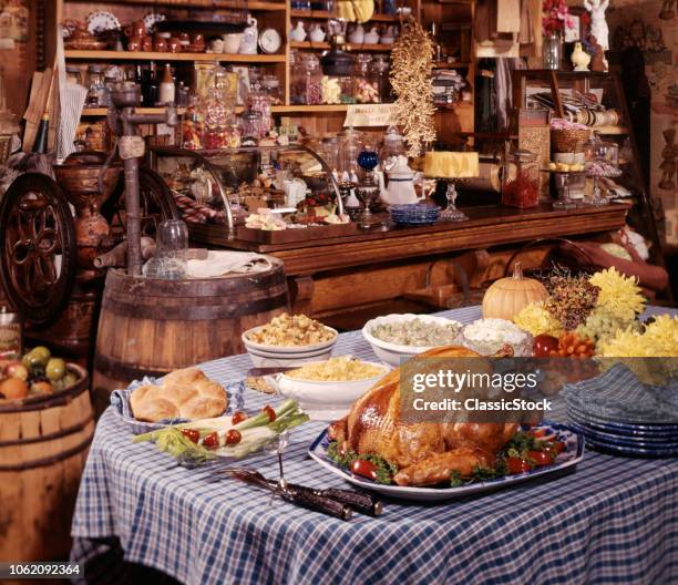 1980s TURKEY DINNER WITH STUFFING & VEGETABLES ON TABLE INSIDE OLD GENERAL STORE