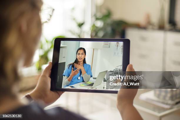 she doesn't need a prescription for this tablet - telemedicine stock pictures, royalty-free photos & images