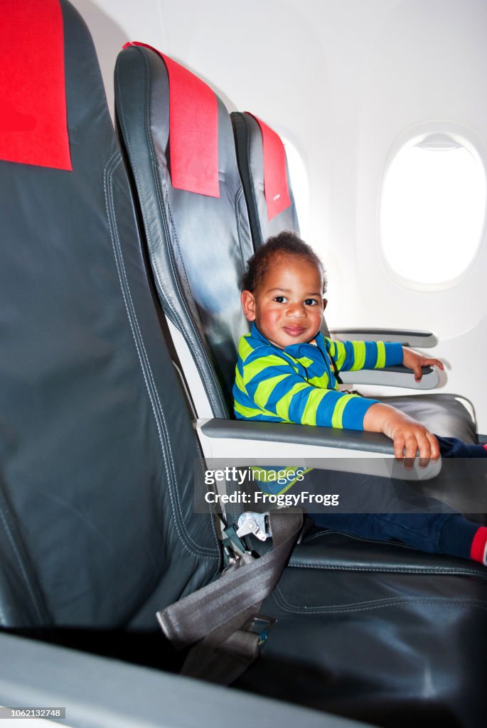 Inspecting My Private Jet. An Excited Child Playing Aboard An Airplane