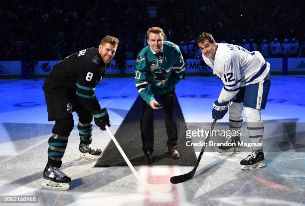 Joe Pavelski, Evgeni Nabokov of the San Jose Sharks and Patrick Marleau of the Toronto Maple Leafs take the ceremonial puck drop at SAP Center on...