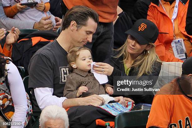 San Francisco Mayor Gavin Newsom sits with his wife Jennifer Siebel and daughter Montana during Game One of the 2010 MLB World Series at AT&T Park on...