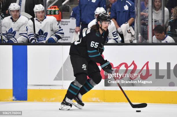 Erik Karlsson of the San Jose Sharks skates ahead with the puck against the Toronto Maple Leafs at SAP Center on November 15, 2018 in San Jose,...