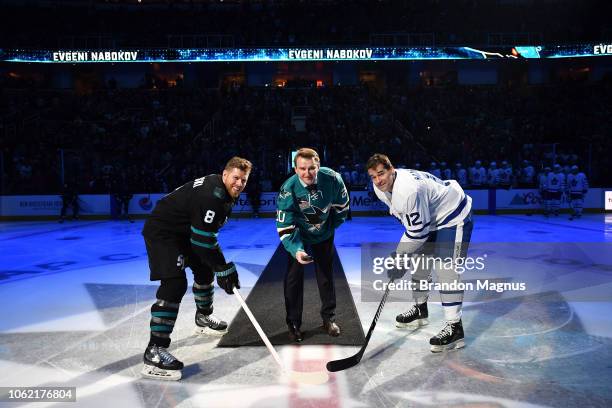 Joe Pavelski, Evgeni Nabokov of the San Jose Sharks and Patrick Marleau of the Toronto Maple Leafs take the ceremonial puck drop at SAP Center on...