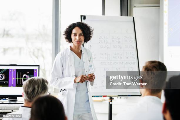 medical registrar hosting teaching session at hospital - lecturer whiteboard stock pictures, royalty-free photos & images