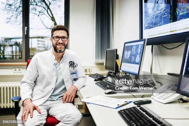 portrait of clinical technician - european doctor stock-fotos und bilder