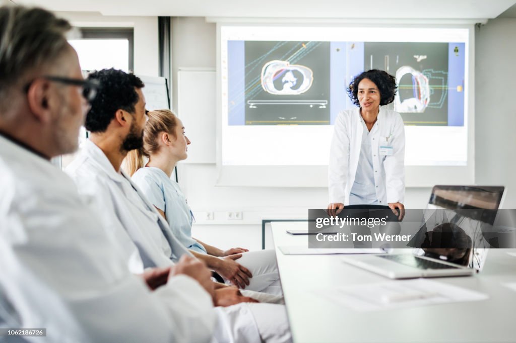 Doctors Discussing Research Data Togeher