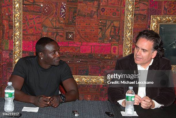 Singer Akon and composer Peter Buffett address the press in a press conference to announce their musical and social action collaboration on June 11,...