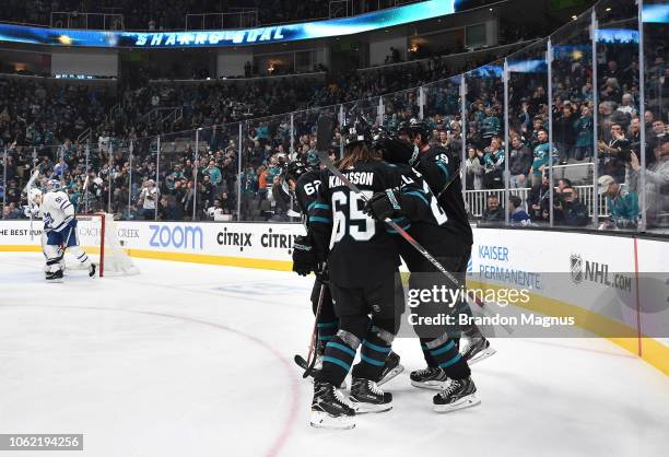 Kevin LaBanc, Erik Karlsson, Marcus Sorensen and Joe Thornton of the San Jose Sharks celebrate a goal against the Toronto Maple Leafs at SAP Center...